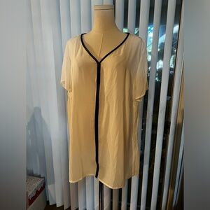 Lane Bryant women’s size 28/20 white top with black detailing.